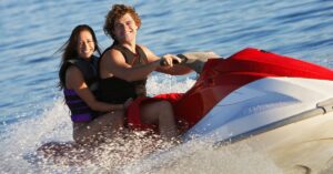 Young Couple on a Jetski after applying for a recreational vehicle loan at NCU
