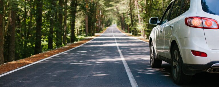 White SUV On The Road after a car loan with NCU