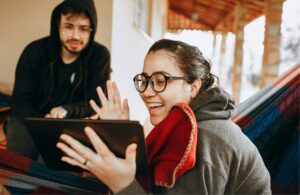 Young Couple At Home Share Savings Account