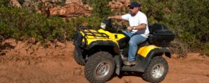 Man on his ATV after checking out atv loan rates at NCU.